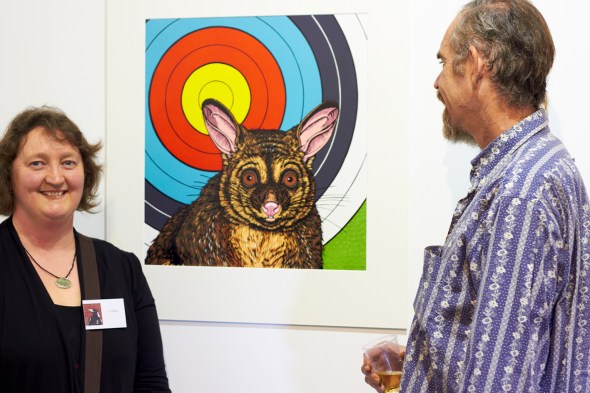 Jo Ogier talking about her woodcut print 'Target' with a fan of her work